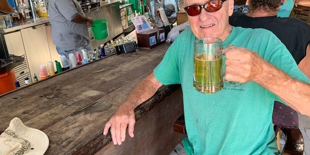 Thomas "Beetlejuice" Trent sits at his reserved seat at Barrier Reef Sports Bar & Grill.