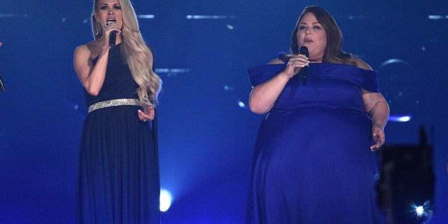 Carrie Underwood, left, and Chrissy Metz perform "I'm Standing with You" at the 54th annual Academy of Country Music Awards at the MGM Grand Garden Arena on Sunday, April 7, 2019, in Las Vegas.