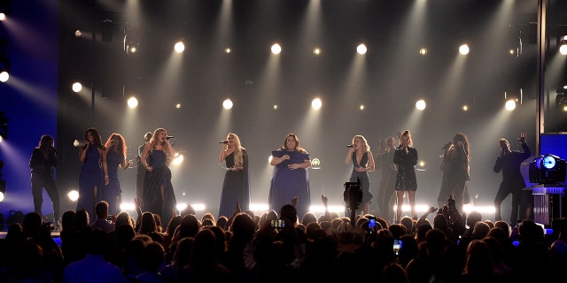 Mickey Guyton, from left, Lauren Alaina, Carrie Underwood, Chrissy Metz, and Maddie Marlow and Tae Dye, of Maddie & Tae, perform "I'm Standing with You" at the 54th annual Academy of Country Music Awards at the MGM Grand Garden Arena on Sunday, April 7, 2019, in Las Vegas. (Photo by Chris Pizzello/Invision/AP)