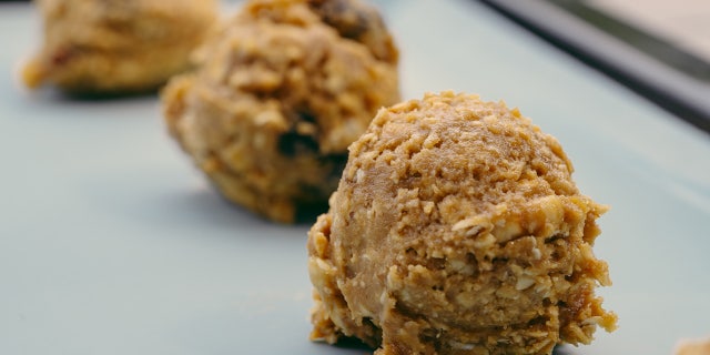 Close-up of cookie dough on baking sheet. These pumpkin cookies go right into the oven after the cookie dough is ready.