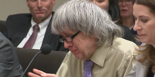 David Turpin reacts in court during his sentencing hearing where he and his wife were jailed for life.