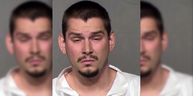 Mugshot for Eldon McInville, 26, accused by police in Glendale, Arizona, of assault and child abuse during the accidental shooting of her 6-year-old daughter while teaching her safety fire arms. 