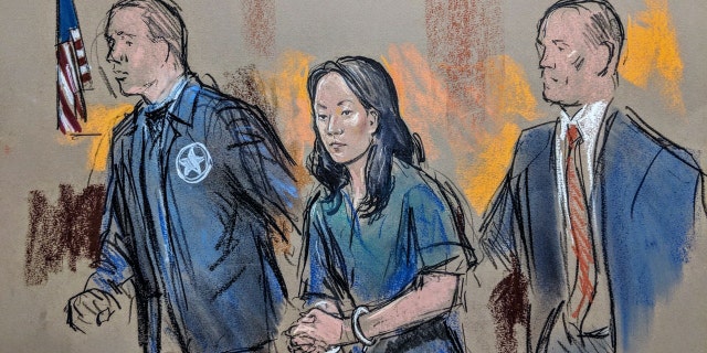 Yujing Zhang being led into federal court in West Palm Beach, Fla., in April.