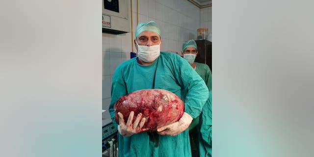 The colossal cyst was removed from a inside a 16-year-old's abdomen by doctors in India.