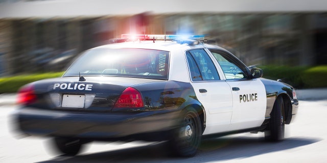A police car races to the scene of an incident.