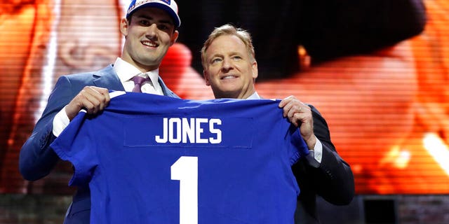 Duke quarterback Daniel Jones poses with NFL Commissioner Roger Goodell after the New York Giants selected Jones in the first round at the NFL football draft, Thursday, April 25, 2019, in Nashville, Tenn.