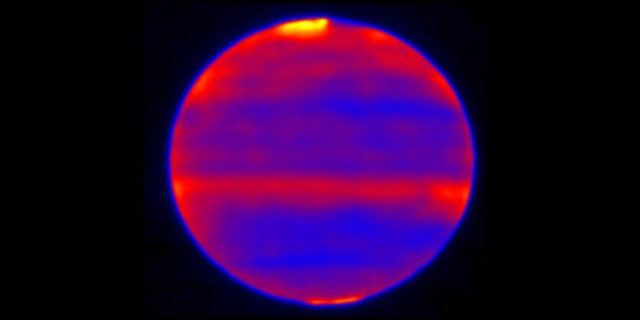 Scientists used red, blue and yellow to infuse this infrared image of Jupiter's atmosphere (red and yellow indicate the hotter regions), which was recorded by the Cooled Mid-Infrared Camera and Spectrograph (COMICS) at the Subaru Telescope on the summit of Mauna Kea, Hawaii on Jan. 12, 2017. (Credit: NAOJ and NASA/JPL-Caltech)
