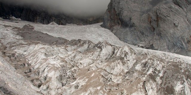 This Sept. 22, 2018 file photo shows the Baishui Glacier No.1 on the Jade Dragon Snow Mountain in the southern province of Yunnan in China. Scientists say it is one of the fastest melting glaciers in the world due to climate change and its relative proximity to the Equator. It has lost 60 percent of its mass and shrunk 250 meters since 1982. (AP Photo/Sam McNeil)