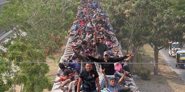 Central American migrants, moving in a caravan through Juchitan, Oaxaca are pictured atop a train known as "The Beast" while continuing their journey toward the United States, in Mexico April 26, 2019.