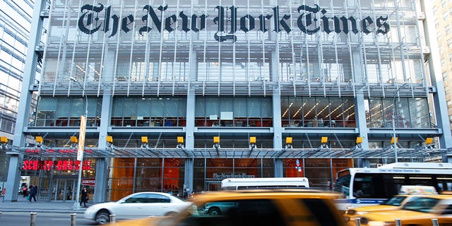 traffic passes by front of NY Times building