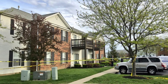 Police tape cordons off the scene where multiple people were found dead Sunday night, at the Lakefront at West Chester apartment complex in West Chester Township, Ohio.