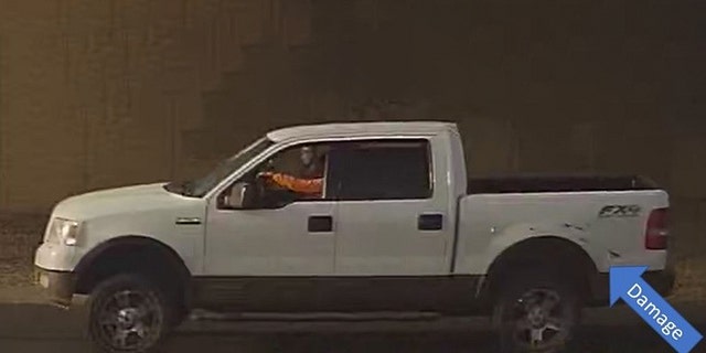 Image from surveillance video of a white pickup with damage that Phoenix police say was involved in a road-rage shooting Wednesday that left a 10-year-old girl dead.