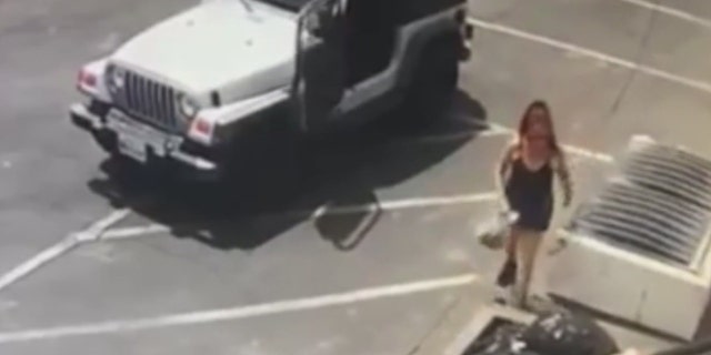 A woman was captured on a surveillance video unloading a bag of puppies behind a dumpster in Coachella, California on Thursday.