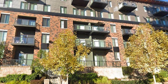 The little boy fell from the top floor of this Redmond apartment building Wednesday.