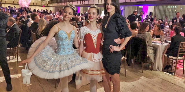 Choreographer Melanie Hamrick poses with dancers at the gala of Youth America Grand Prix, the world’s largest ballet scholarship competition, on Thursday, April 18, after the U.S. premiere of her new ballet, “Porte Rouge” (Red Door), based on classic Rolling Stones tunes arranged by her partner, Mick Jagger. The Stones frontman, recovering from medical treatment, watched from backstage and addressed the audience briefly via microphone before the show. (AP Photo/Jocelyn Noveck)
