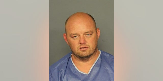 Ryan Ashland, 41, has been arrested in connection with a baseball bat attack outside a Denver strip club, authorities say. (Denver Police Department)