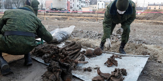 Soldiers from a special "search battalion" of Belarus Defence Ministry collect the remains of about 730 prisoners of a former Jewish ghetto, discovered in a mass grave at a construction site in the center of Brest, Belarus February 26, 2019. REUTERS/Vasily Fedosenko - RC1F95AFA340