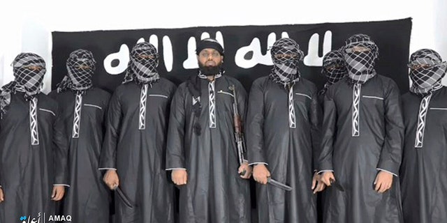 This undated image posted by the Islamic State group's Aamaq news agency on Tuesday purports to show Mohammed Zahran, a.k.a. Zahran Hashmi, center, the man Sri Lanka says led the Easter attack that killed more than 350 people, as well as other attackers.