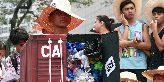 Environmental activists protesting the tons of garbage Canada shipped to the Philippines in front of the Canadian Embassy in Makati in 2015.<br data-cke-eol="1">