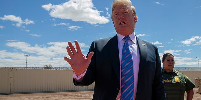President Donald Trump speaks as he visits a new section of the border wall with Mexico in Calexico, Calif., Friday April 5, 2019. (AP Photo/Jacquelyn Martin)