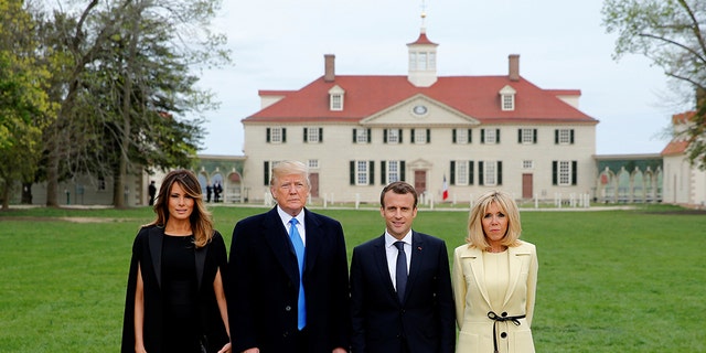 President Donald Trump and first lady Melania Trump and French President Emmanuel Macron and Brigitte Macron pose in front of Mount Vernon, on April 23, 2018. 