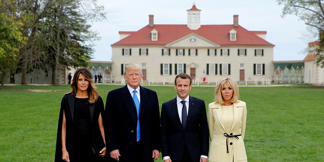 President Donald Trump and first lady Melania Trump and French President Emmanuel Macron and Brigitte Macron pose in front of Mount Vernon, on April 23, 2018.