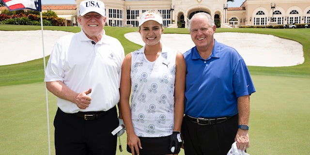 President Trump poses with professional golfer Lexi Thompson and radio host Rush Limbaugh on Friday, April 19, 2019.