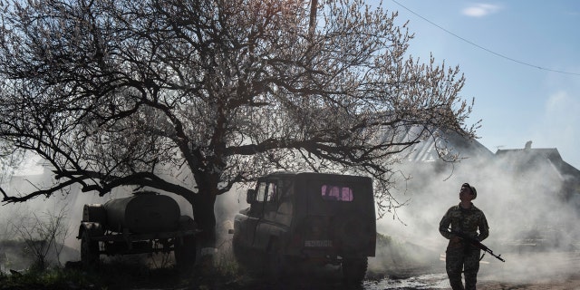 A Ukrainian serviceman guards a position near the front line as the conflict continues, in Mariinka, Donetsk region, eastern Ukraine, Saturday, April 20, 2019. The conflict in eastern Ukraine has killed more than 13,000 people since 2014.