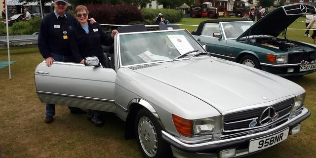 William Reid and Kathryn Workman were putting their Mercedes-Benz convertible away for the winter.