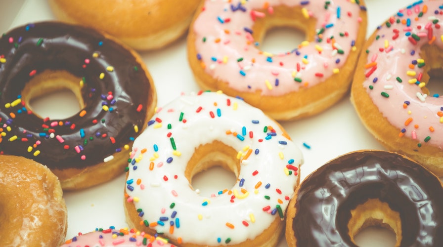 Couples get married with doughnut bouquets