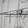 A technician works on high-voltage pylons in Frankfurt, Germany, April 9, 2019. 