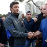 Opposition leader Leopoldo Lopez, is greeted by a supporter outside La Carlota air base in Caracas, April 30, 2019. 