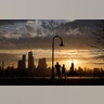 The sun rises behind the skyline of midtown Manhattan in New York City on March 31, 2019. 