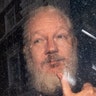 Julian Assange arrives at Westminster Magistrates' Court after the WikiLeaks founder was arrested in London, April 11, 2019. 