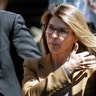 Actress Lori Loughlin arrives at federal court to face charges in a nationwide college admissions bribery scandal in Boston, April 3, 2019.