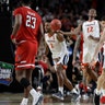 Virginia's Kyle Guy celebrates in front of Texas Tech players after winning the men's NCAA basketball championship in Minneapolis, April 8, 2019.