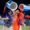 Texas Rangers' Hunter Pence is doused by Elvis Andrus and Rougned Odor following the team's baseball game against the Houston Astros in Arlington, Texas, April 3, 2019.