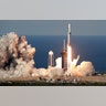 A SpaceX Falcon Heavy rocket carrying a communication satellite lifts off from pad 39A at the Kennedy Space Center in Cape Canaveral, Florida, April 11, 2019. 