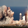 A SpaceX Falcon Heavy rocket carrying a communication satellite lifts off from pad 39A at the Kennedy Space Center in Cape Canaveral, Florida, April 11, 2019. 