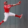 Cincinnati Reds right fielder Yasiel Puig catches a fly ball by Miami Marlins' Curtis Granderson in the first inning of a baseball game in Cincinnati, April 11, 2019. 