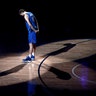 Dallas Mavericks forward Dirk Nowitzki stands on the court listening as former players pay tribute to him after his final home game in Dallas, April 9, 2019. 