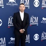 Kane Brown keeps it classic in a black suit.