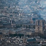 Smoke and flames rise during a fire at the landmark Notre Dame Cathedral in central Paris. 