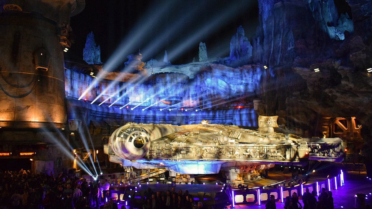 Millennium Falcon: Smuggler’s Run attraction lit up during the dedication ceremony of Star Wars: Galaxy’s Edge. Walt Disney Imagineer, Asa Kalama, the creative lead on developing the Millennium Falcon ride, said “from early on in development we knew we wanted to allow people to fly the Falcon.” Those Imagineers teamed up with Lucasfilm to create a 1:1 replica of the Millennium Falcon set as it appeared in the latest film “Star Wars: The Last Jedi,” and that’s where the story begins.