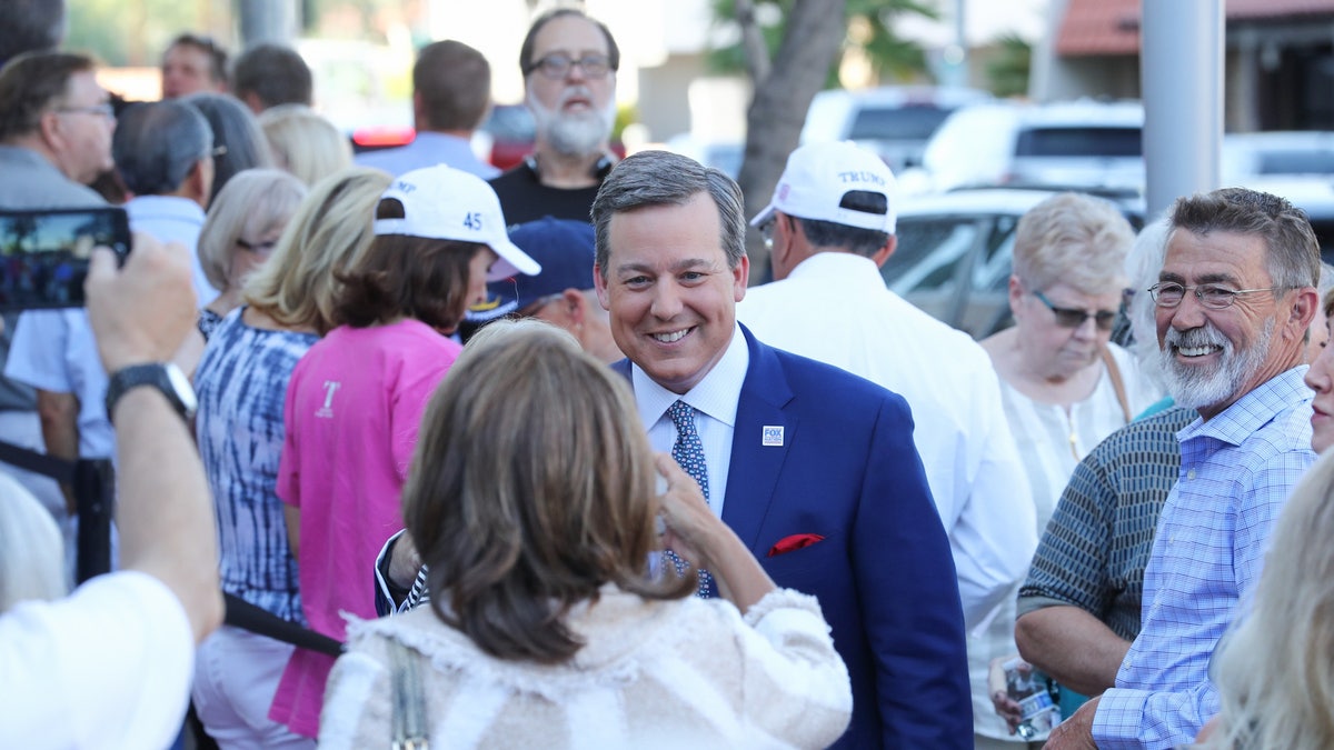 Fox News' Ed Henry chats with fans before the Fox Nation summit Tuesday in Arizona.