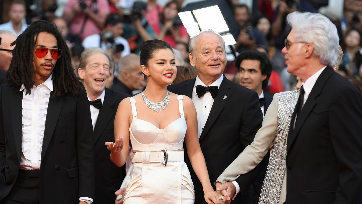 Actors Luka Sabbat, from left, Selena Gomez, Bill Murray, and director Jim Jarmusch pose for photographers upon arrival at the opening ceremony and the premiere of the film 'The Dead Don't Die' at the 72nd international film festival, Cannes, southern France, Tuesday, May 14, 2019. (AP)