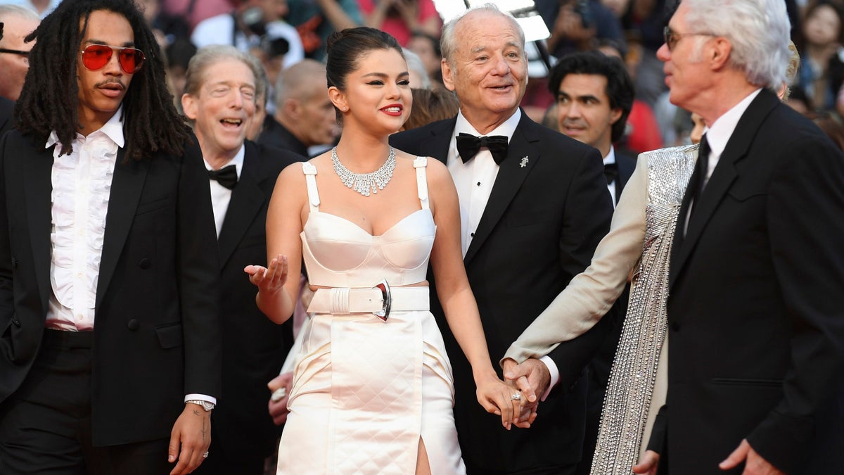Actors Luka Sabbat, from left, Selena Gomez, Bill Murray, and director Jim Jarmusch pose for photographers upon arrival at the opening ceremony and the premiere of the film 'The Dead Don't Die' at the 72nd international film festival, Cannes, southern France, Tuesday, May 14, 2019. (AP)