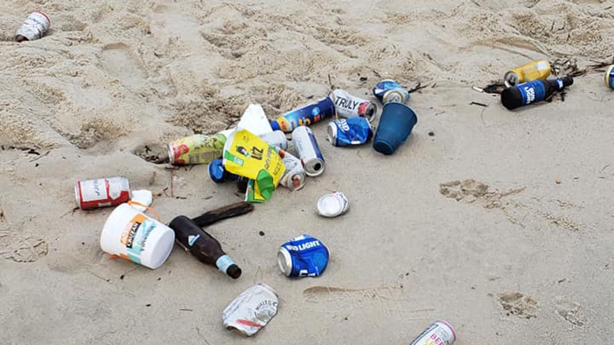 Beer bottles littered Chic's Beach in Virginia Beach after "Floatopia" on Sunday night.