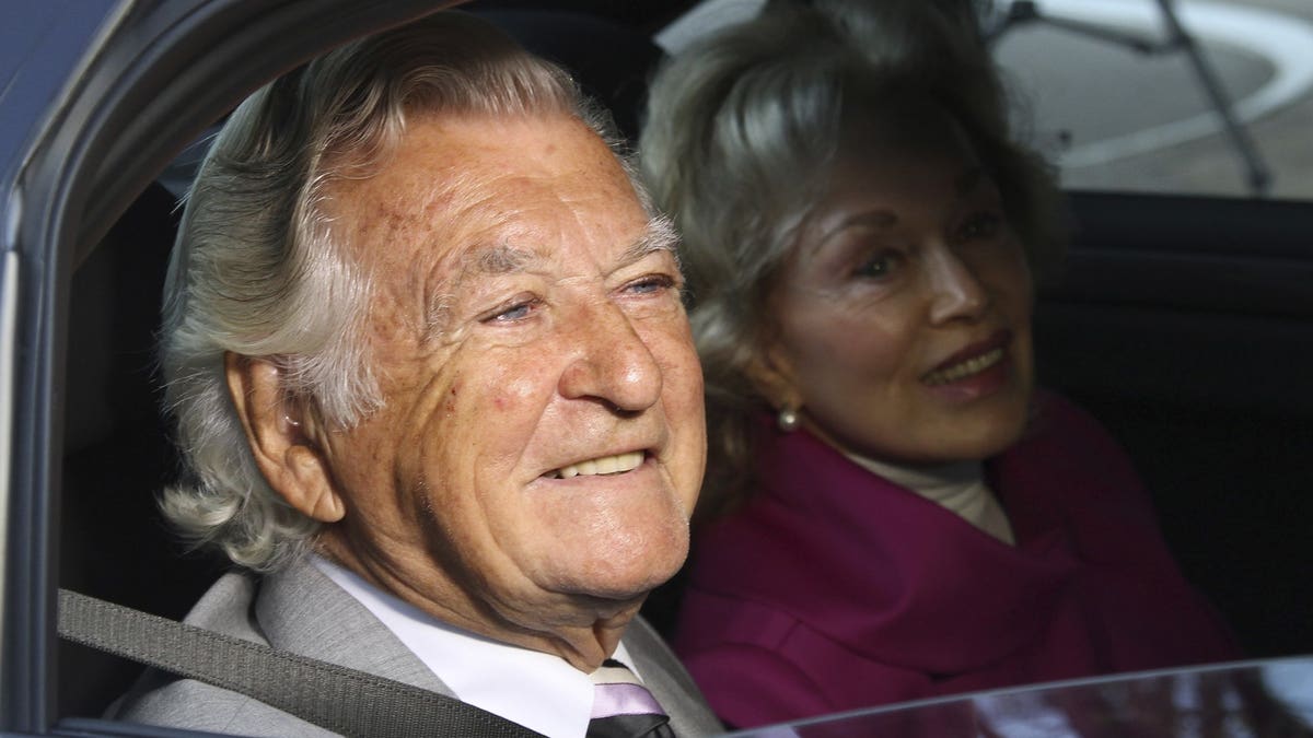 In this Sept. 2013, file photo, former Australian Prime Minister Bob Hawke, left, and his wife Blanche d'Alpuget arrive at the Australian Labor Party's campaign launch in Brisbane, Australia. Hawke, Australia's 23rd prime minister, has died in Sydney at age 89.