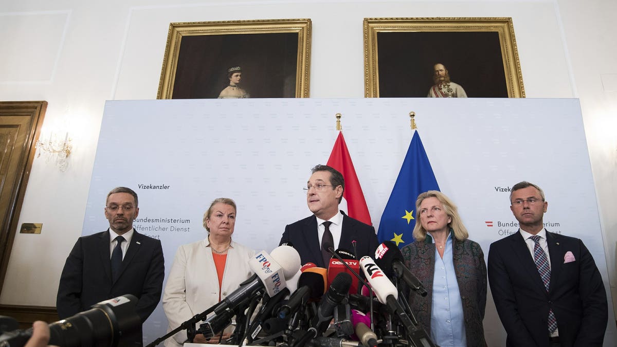 Austrian Vice Chancellor Heinz-Christian Strache (Austrian Freedom Party), center, addresses the media during press conference at the sport ministry in Vienna, Austria, Saturday, May 18, 2019. Strache says he is resigning after two German newspapers published footage of him apparently offering lucrative government contracts to a potential Russian benefactor.